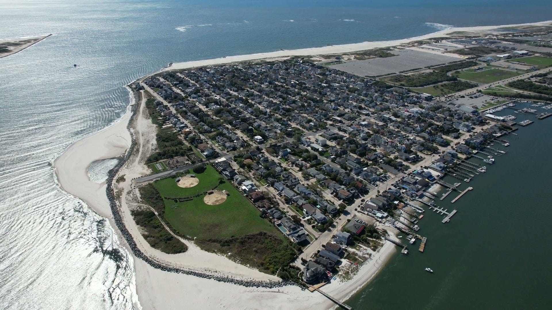 Point Lookout from the air: the ball fields and rock-lined shore at the east end, Jones Inlet, the ocean beach and boat docks along the bay