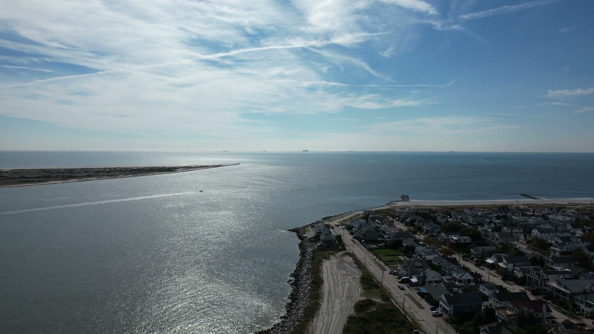 Jones Inlet from the air, with Jones Beach across the water and the rock-lined east end of Point Lookout in the foreground