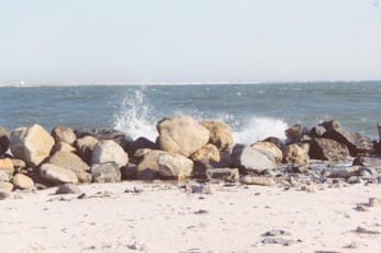 Rock placed against the eroding inlet shore